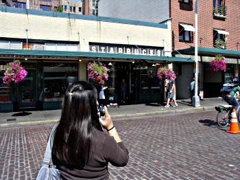 Jaime on the phone in front of the first Starbucks ever!